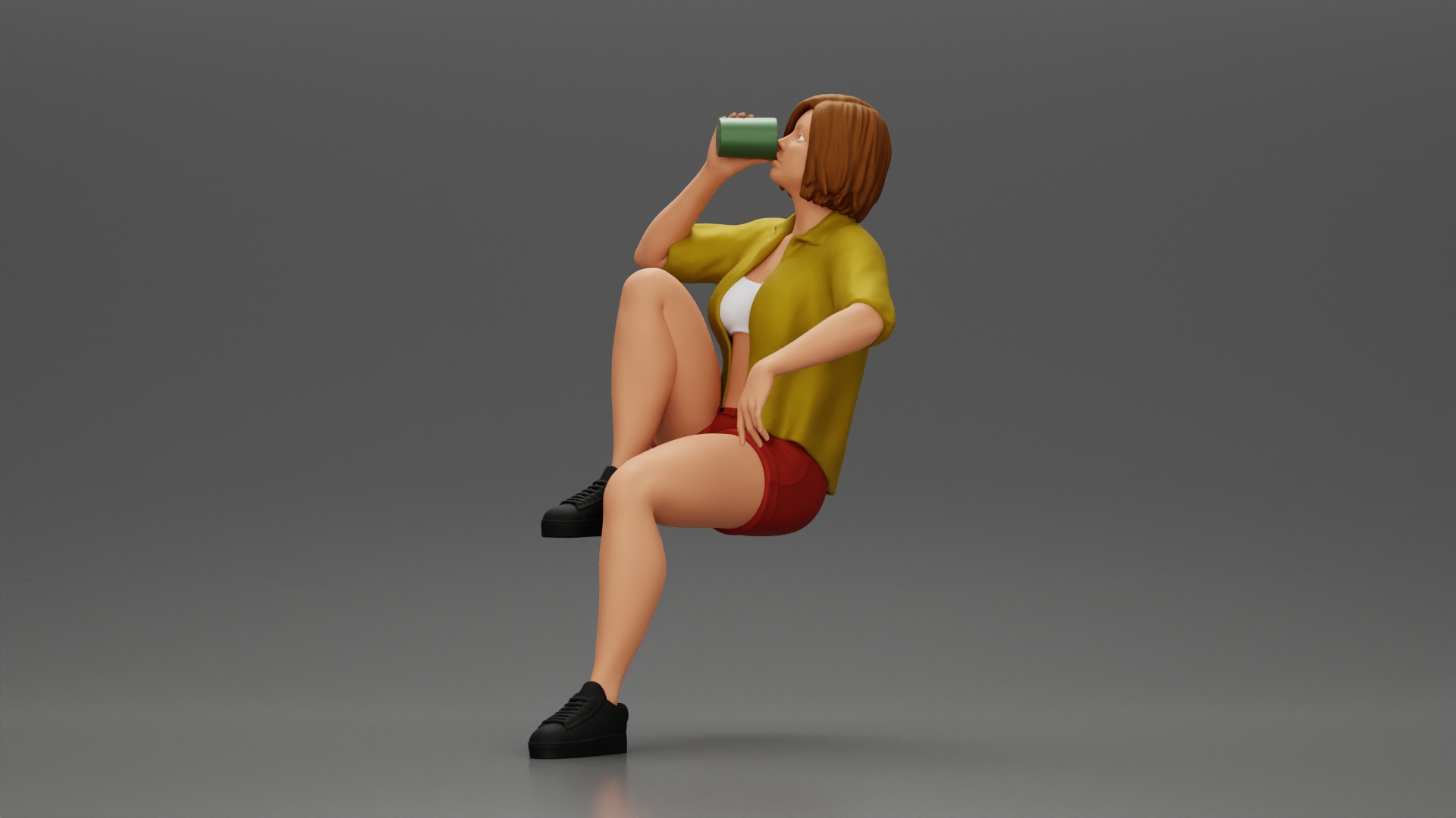 Young woman sitting on a chair hugging her pulled-up leg while drinking