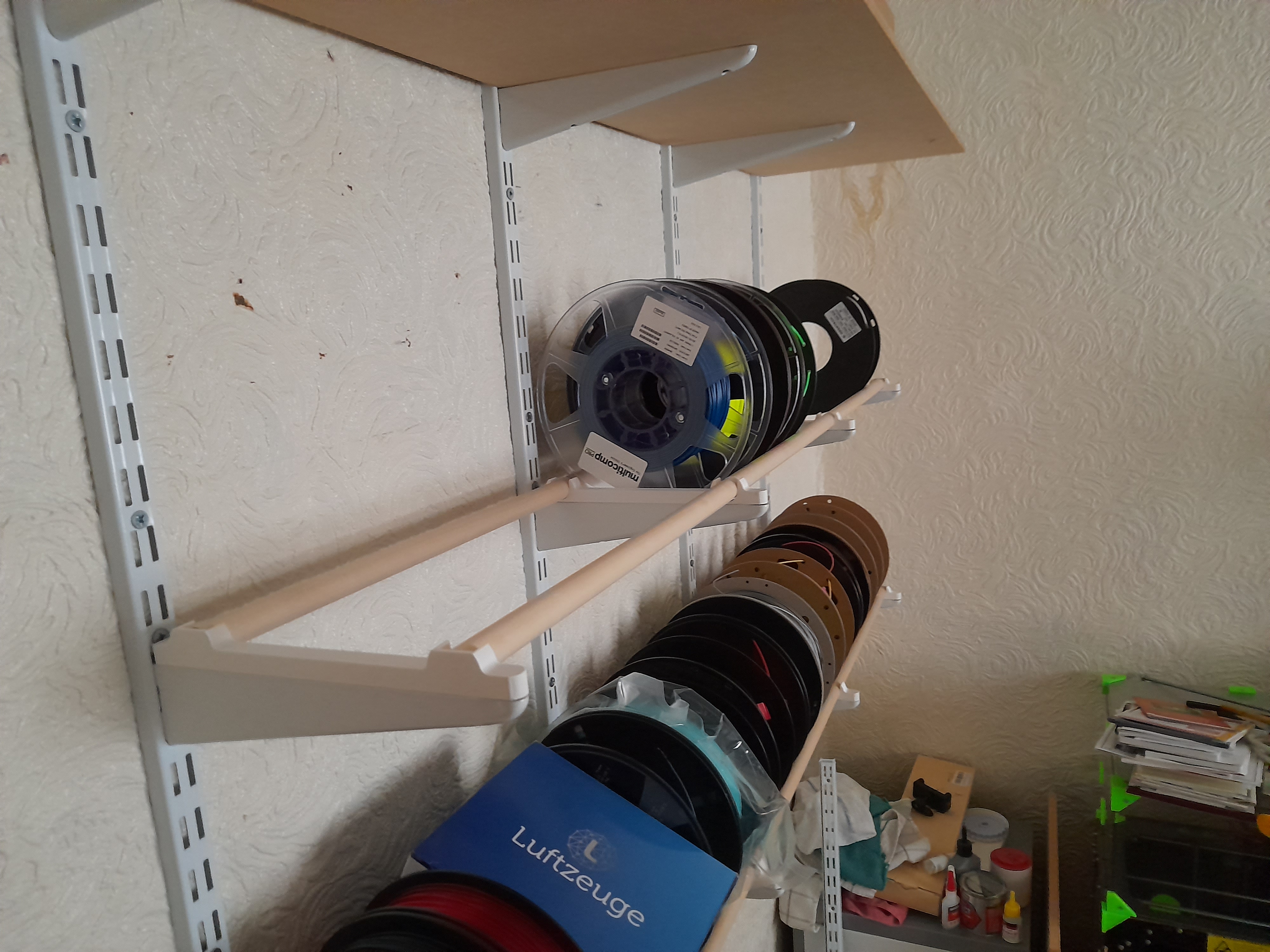Rod support for twin slot shelving
