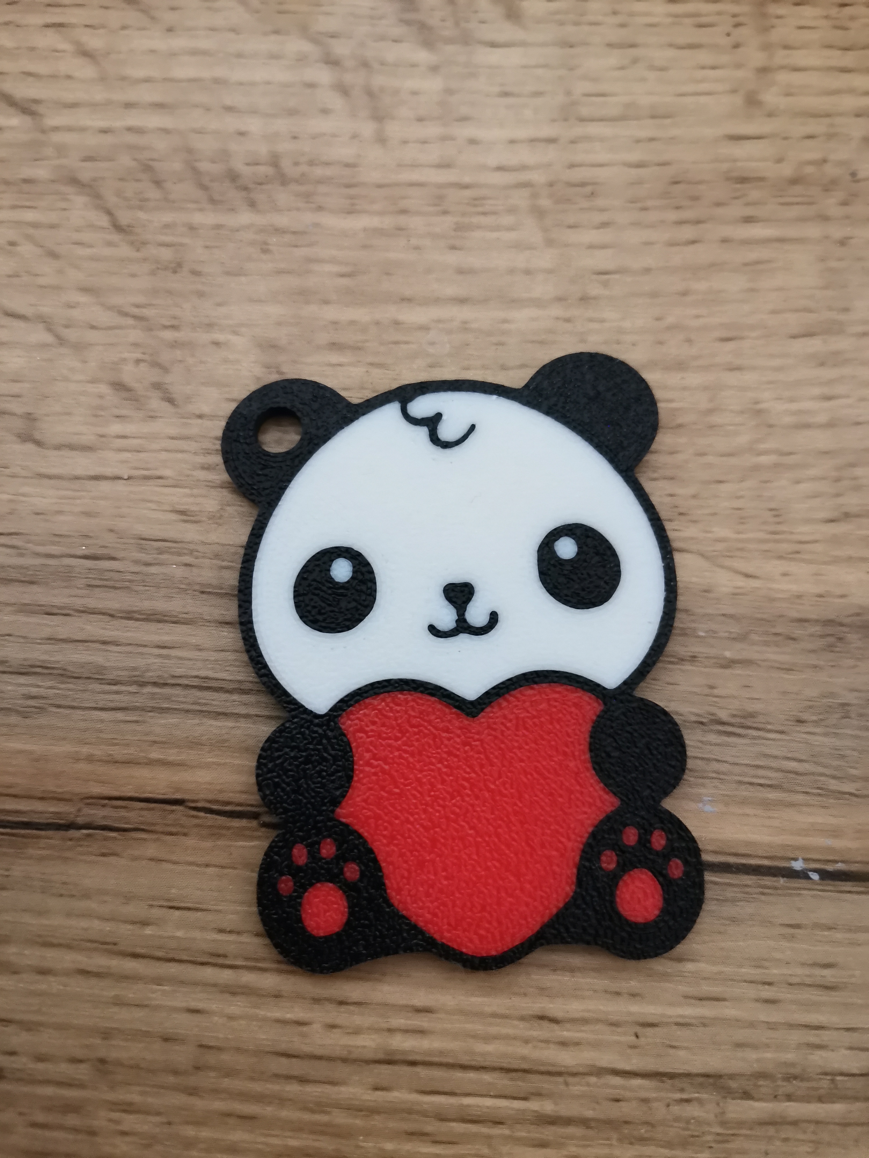 Cute multicolor panda with a heart keychain