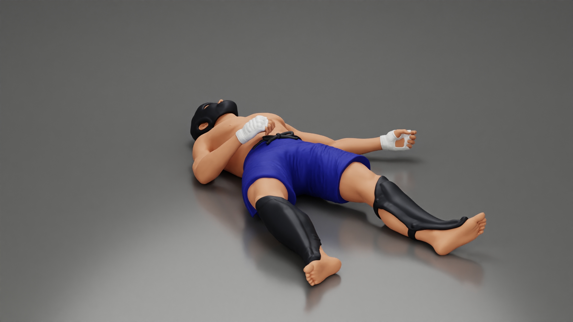 Defeated fighter lying on the floor after the battle